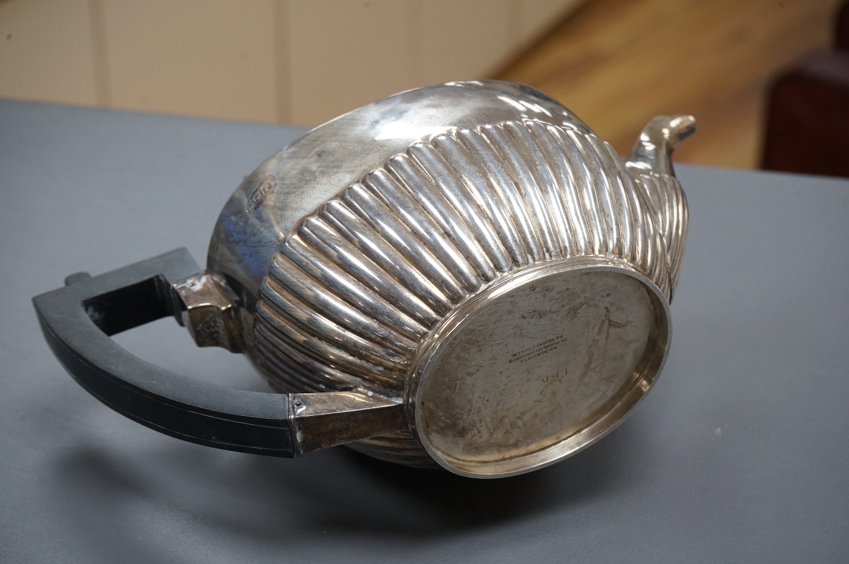An Edwardian demi-fluted silver oval teapot, by Goldsmiths & Silversmiths Co Ltd, London, 1901, gross 18.8oz.